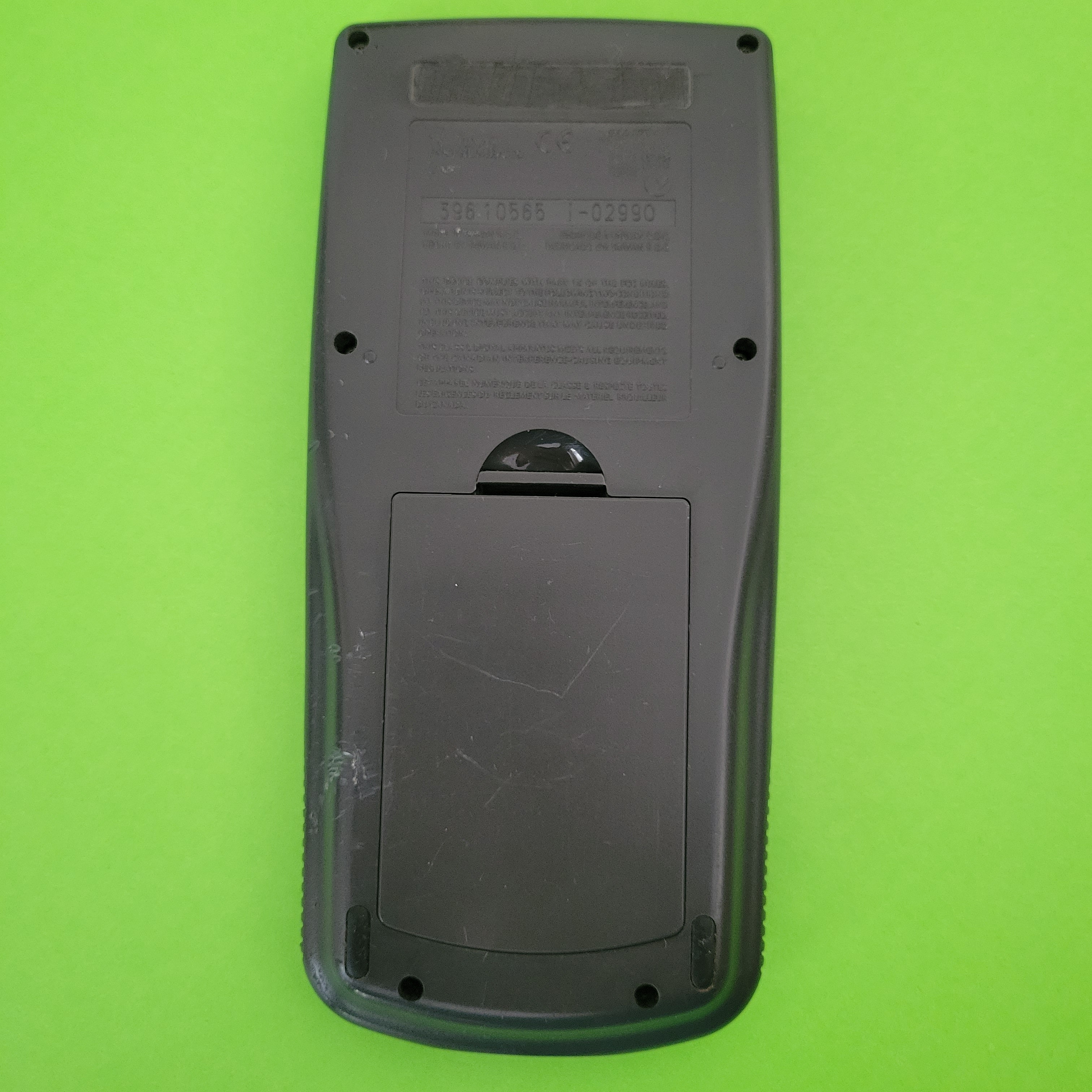 An image of the back of a texas instruments ti83 graphing calculator